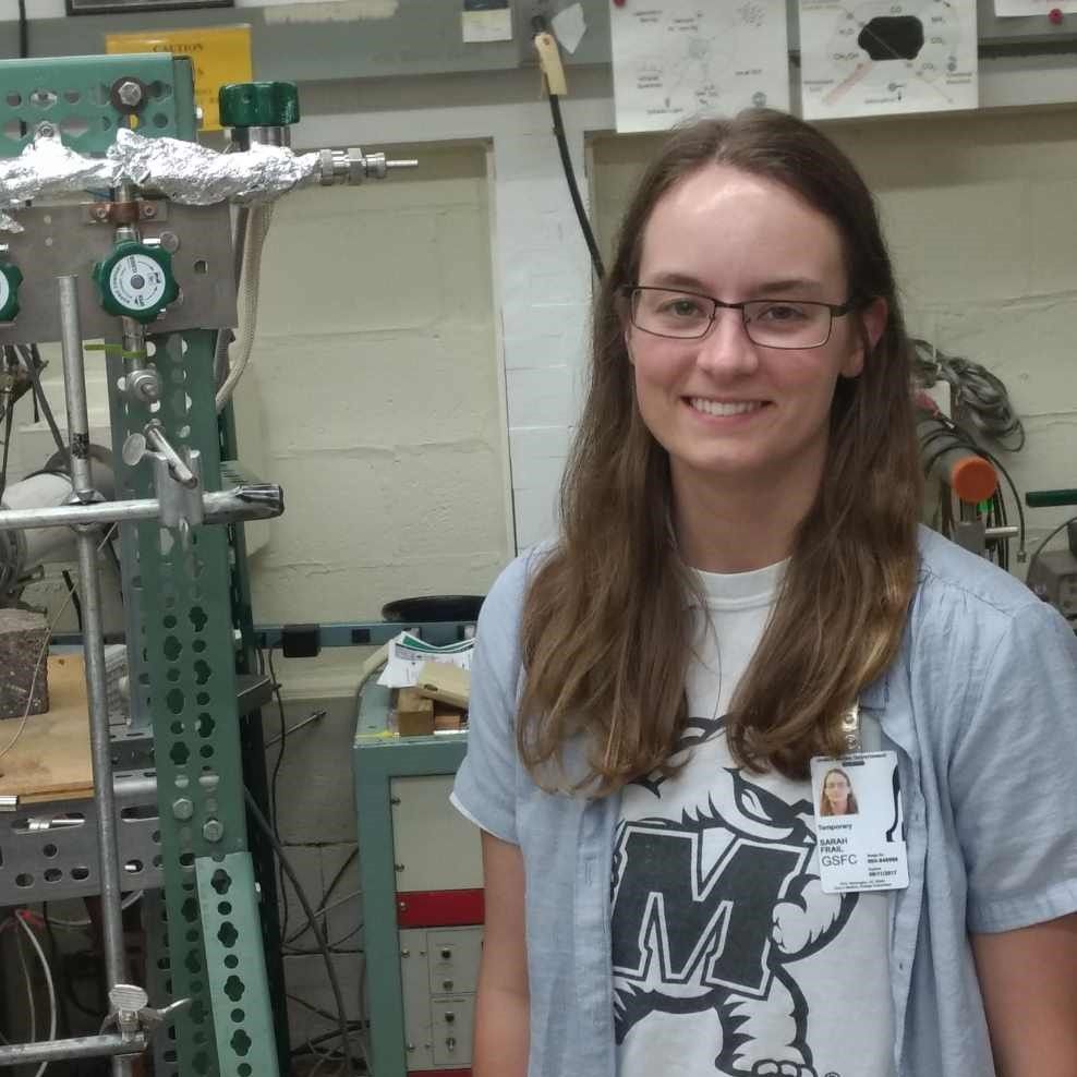 Woman with glasses and long brown hair